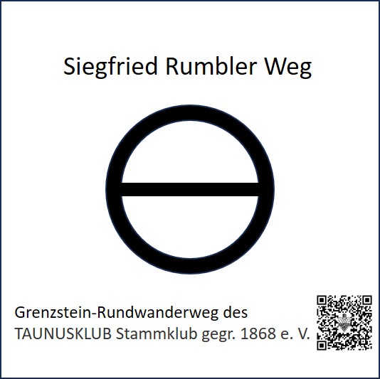 Foto des Wegzeichens, welches angebracht wird. Darauf zu sehen ein schwarzer Kreis mit einem schwarzen horizontalen Strich durch den Kreis auf weißem Grund, Schrift: TAUNUSKLUB Stammklub gegr. 1868 e. V.